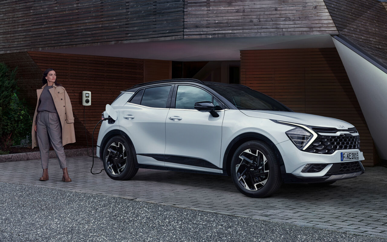 Kia SUV with modern background